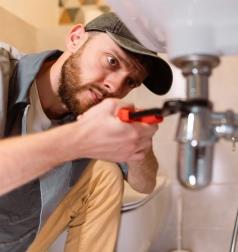 Plumber working on sink repair in Atwater